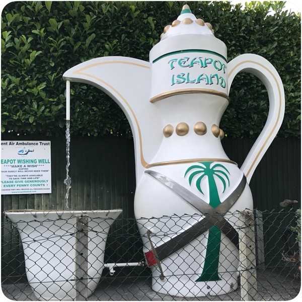 Coin fountain in the shape of a teapot.