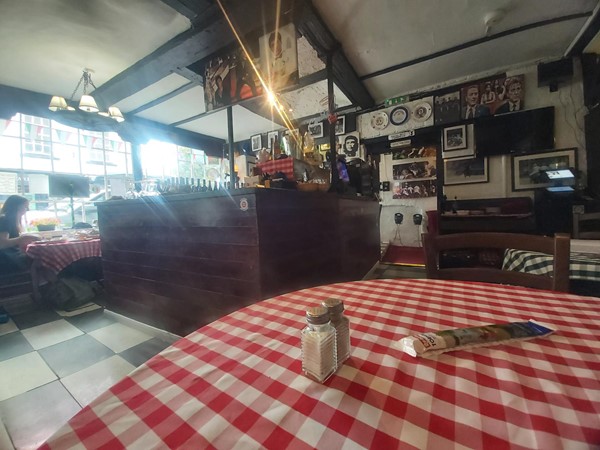 Image of a table with a red and white checkered tablecloth