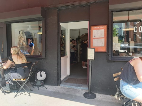 Image of a people sitting outside a cafe