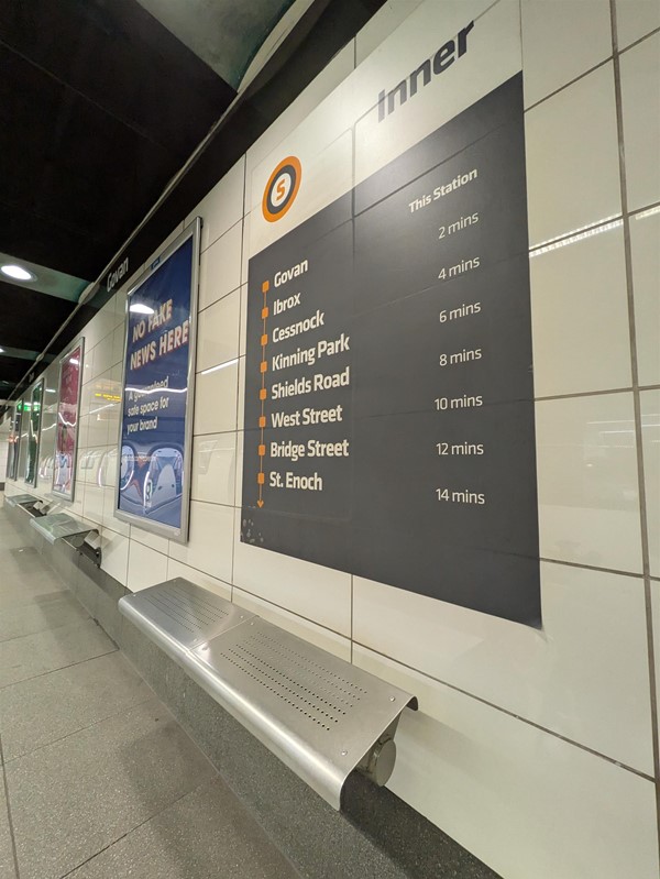 image of seating on platforms, metal seats mounted to the wall