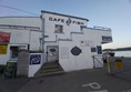 Image of a white building with a sign on it