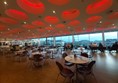 General view of restaurant looking towards the floor to ceiling picture windows