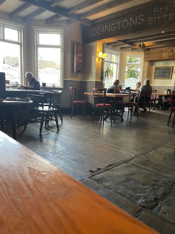 Image of a bar room with tables and chairs