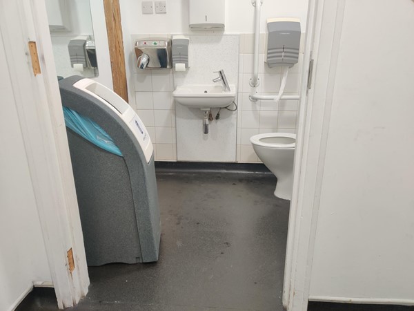 A huge bin idiotically placed to obstruct the doorway into the toilet cubicle. Appalling.