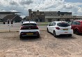 Image of a group of cars parked in a parking lot