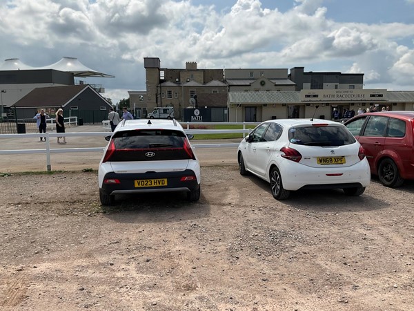 Image of a group of cars parked in a parking lot