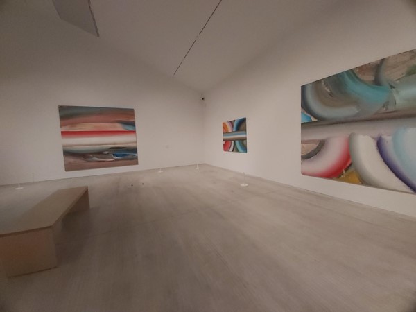 Image of a room with paintings on the wall