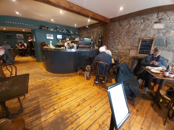 Image of a group of people sitting at a bar