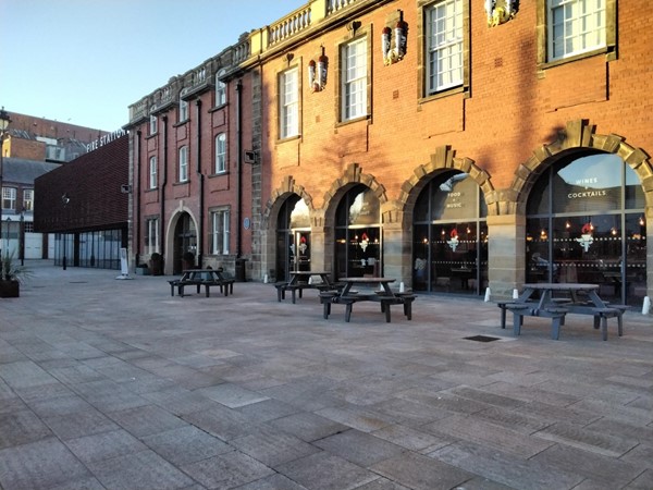 The arches are where each fire engine would be, with the 5th arch the main entrance.