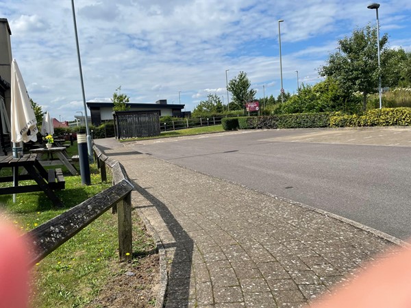 Nearest accessible disabled parking tucked around the side