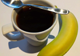 Breakfast. Black coffee and a banana