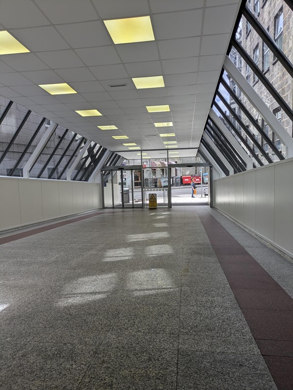 Image of the Guild Street entrance from inside. A steep descending slope