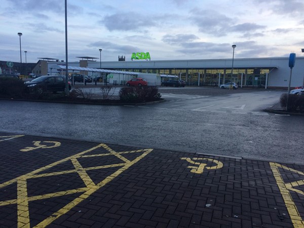 Photo of Asda and car park.