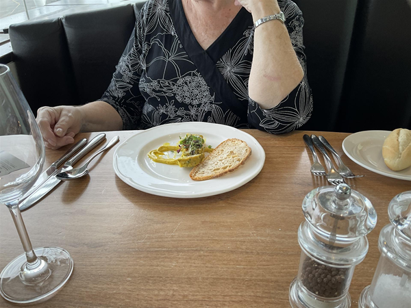 Image of a person sat at a table