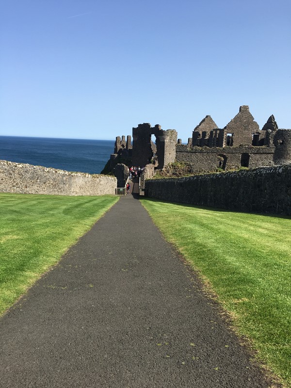 View of castle from entrance showing decline onto bridge all level access