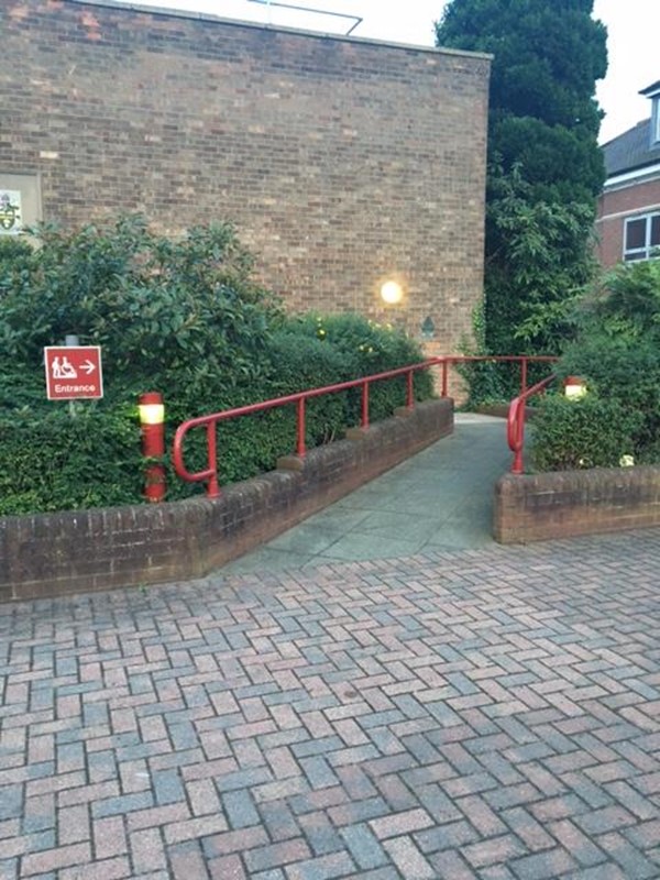 Disabled entrance, just to the right of the front entrance to the theatre