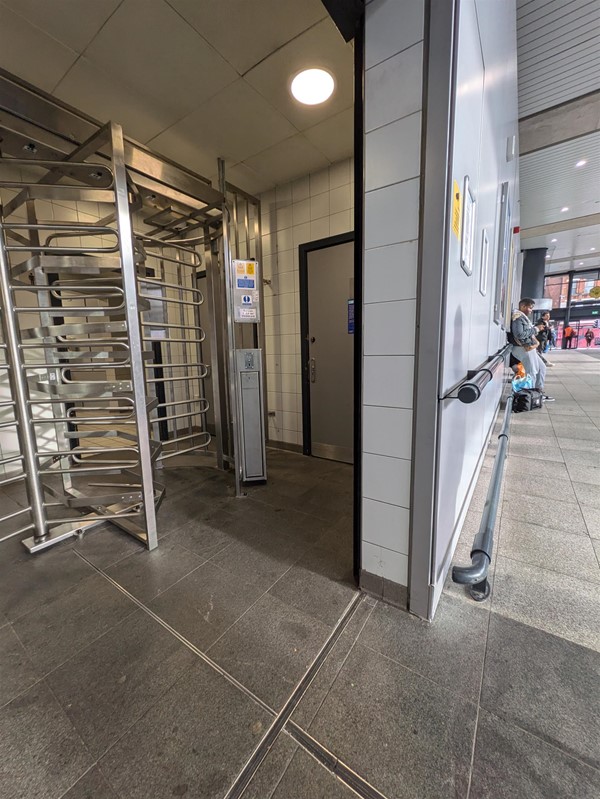 Image of the turnstile and door to the accessible toilet