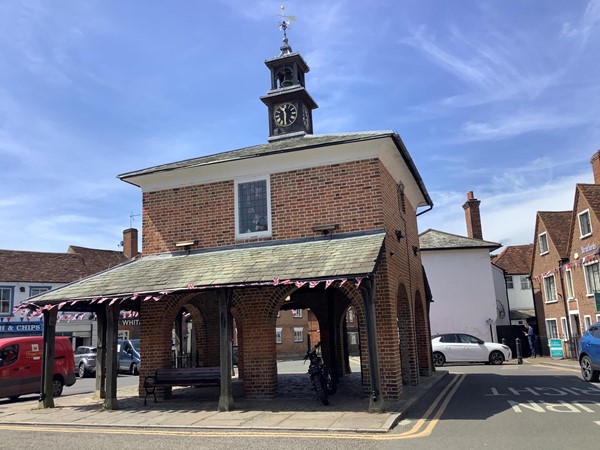 Picture of a square building with a clock tower