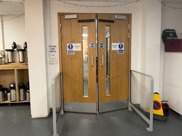 Two automatic doors leading to a hallway.