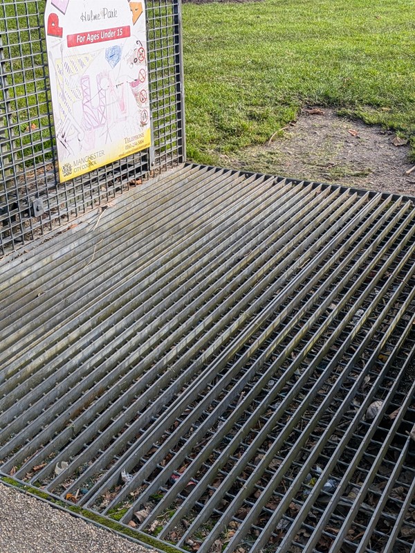 Image of grate at the entrance to the park