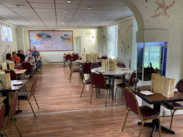 Image of a room with tables and chairs