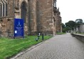 Heading towards the wheelchair accessible entrance over flat cobbles.