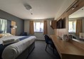 Image of bed and desk in the accessible hotel room