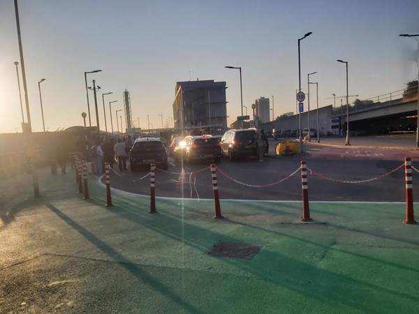 Image of a group of people standing on a road