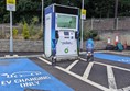 Image of a charging station in a parking lot