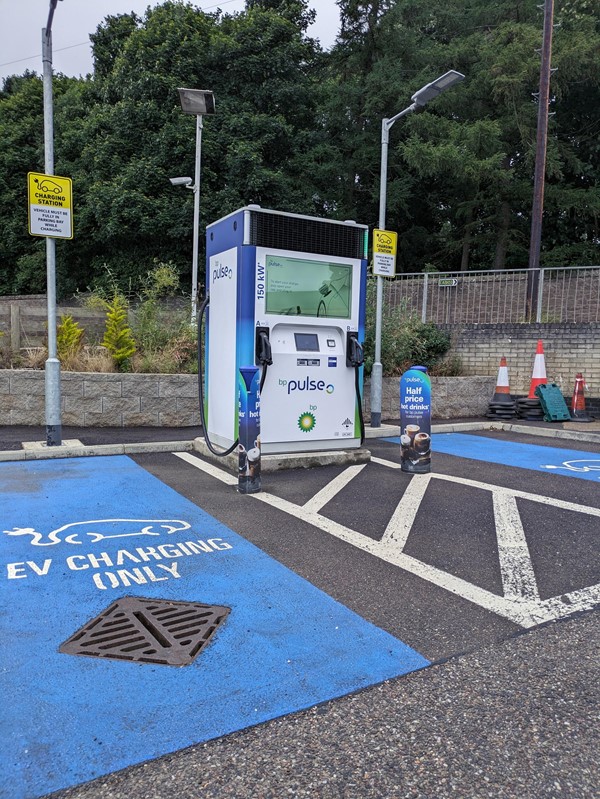 Image of a charging station in a parking lot