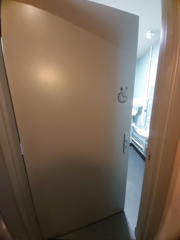 Image of the door to the accessible toilet.