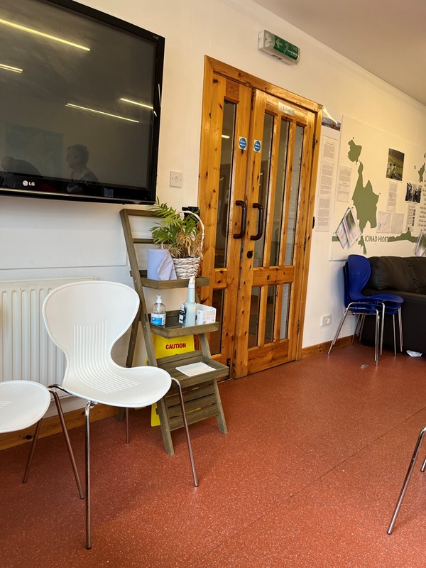 Corridor with chairs and a double door