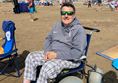 Image of a beach wheelchair user