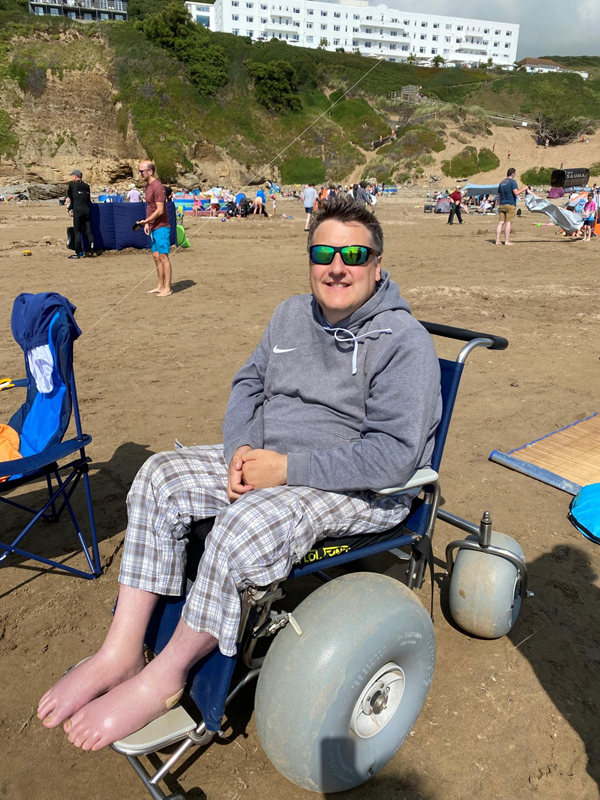 Image of a beach wheelchair user