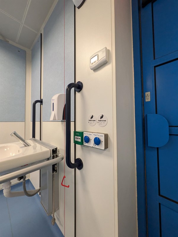 Image of lock and unlock buttons in the Changing Places toilet