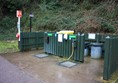 General service point with easy access drinking water and bins.