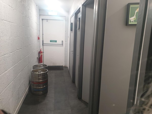 Image of the corridor leading to the individual toilets.