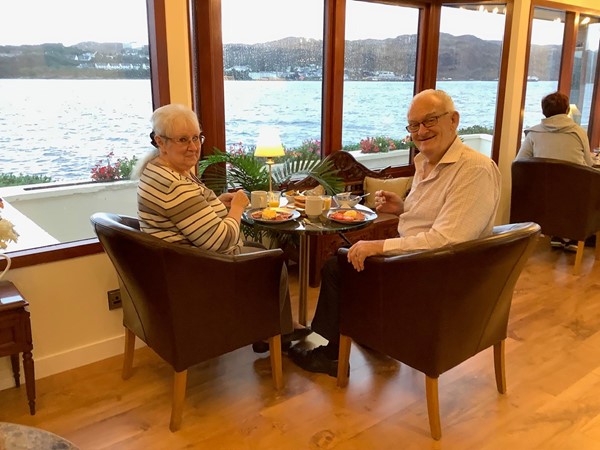 Image of two people sat at a restaurant table