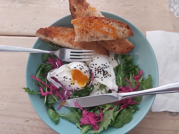 Image of a bowl of salad with fork and knife