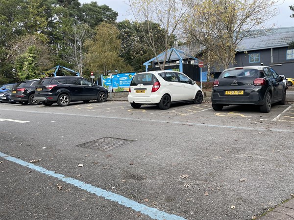 Disabled parking, several cars without disable blue badges.