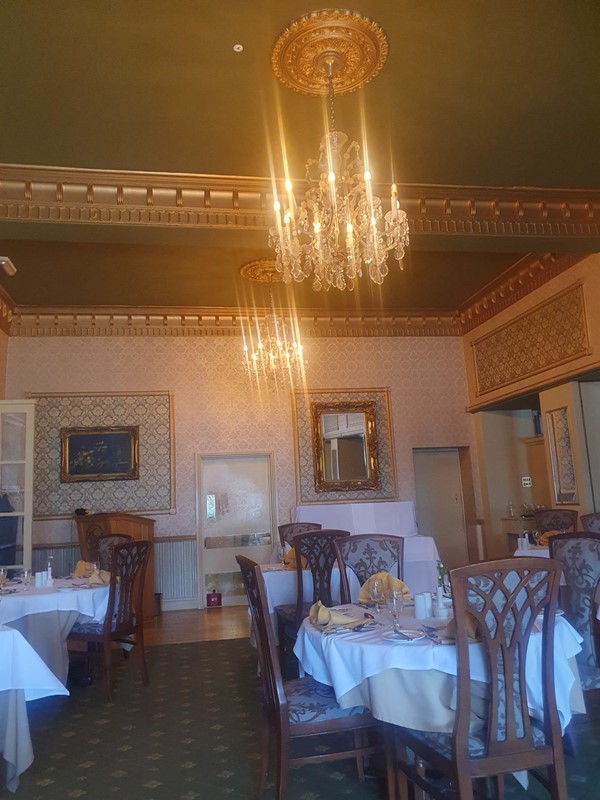 Image of a dining room with chandeliers