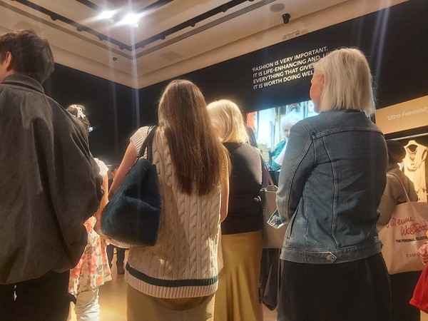 A group of people looking at a display