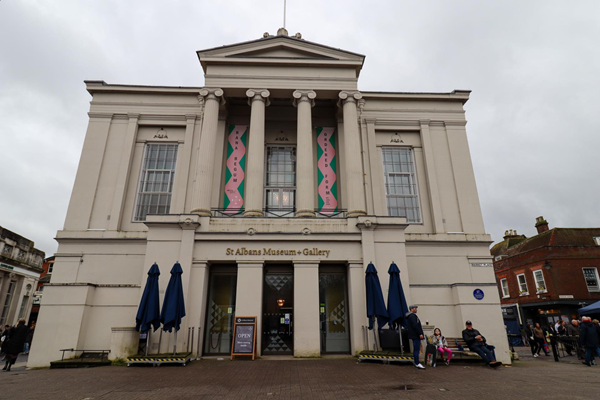 Front view of museum, a white rather grand building.