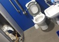 Picture of disabled toilet being used as a store cupboard