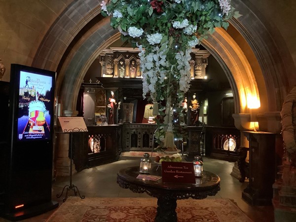 Picture of a stome arch leading to a reception desk