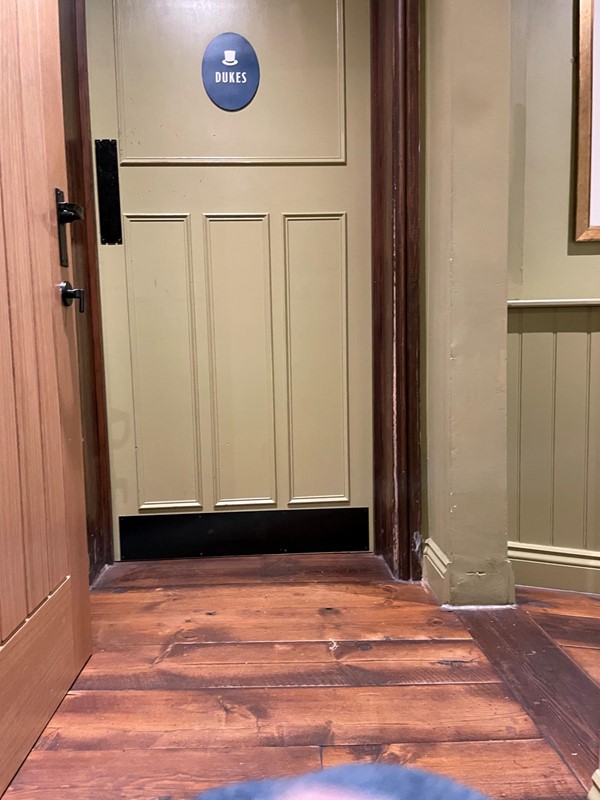 Image of a door with a blue circle on the top