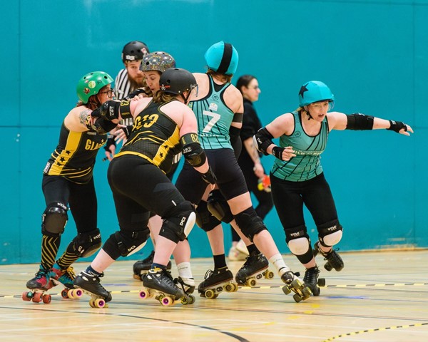 The skaters with stars on their helmets are the jammers. They will try and get past the pack to score points.