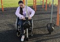 Image of reviewer using accessible play equipment.