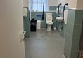 Image of an accessible toilet from the doorway