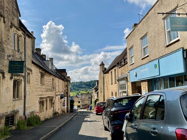 Image of a street with cars parked on it